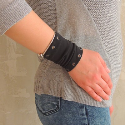 Black wrist cuff bracelet with metal grommets