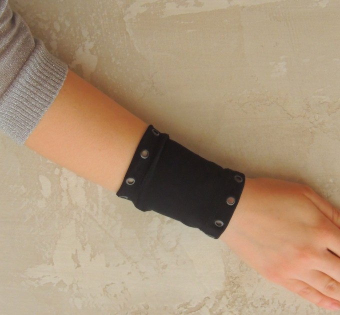 Black wrist cuff bracelet with metal grommets