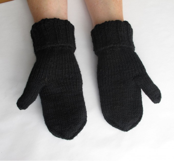  Knitted black mittens with mountains
