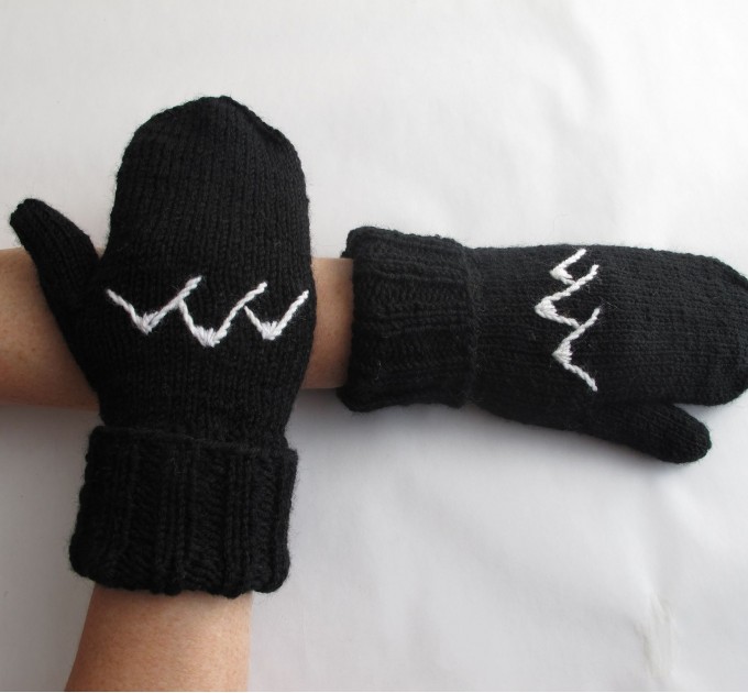  Knitted black mittens with mountains